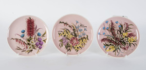 GUY BOYD three Australian pottery wildflower plates, signed "Guy Boyd Australia", 18.5cm diameter