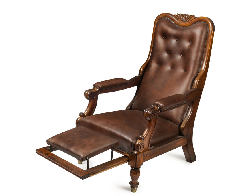 A Colonial adjustable armchair with slide out footrest, blackwood and leather, Tasmanian origin, circa 1845, 67cm across the arms