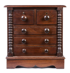 A miniature chest of drawers with half bobbin columns, Australian cedar, 19th century ​Note: Restoration work done in the 20th century revealed the mark for J. SLY the famed Sydney cabinet maker, this piece would appear to be the work of an apprentice of 