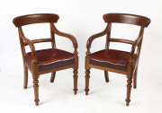 A pair of Colonial spade back library carver chairs, cedar with burgundy leather upholstery, crica 1880, 54cm across the arms