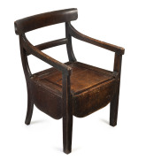 A Colonial spadeback commode, Australian cedar, circa 1840, 55cm across the arms