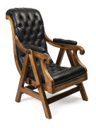 A Colonial Australian rocking chair, Tasmanian blackwood frame with black button-back leather upholstery, 19th century, ​54cm across the arms