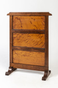 A firescreen, mottled kauri and blackwood, circa 1900, 67cm high, 53cm across