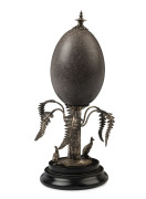 An Australian emu egg, silver plated mounts on a wooden stand, late 19th century, 28cm high