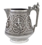 Indian, silver milk jug, late 19th Century; the handle with a crouching Indian being menaced by a cobra. Height: 9cm. Weight: 125gms.