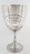 A large, sterling silver footed & stemmed trophy cup by Hamiltons, Calcutta. Inscribed "SHORNCLIFFE CAMP DRAG HUNT - FARMERS RACE - 1895 - POINT TO POINT RACES. Height: 28.5cm Weight: 820gms.