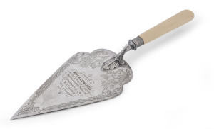 A silver plated presentation trowel "Presented To Mrs. G.A. Edwards, On The Occasion Of Laying The Foundation Stone Of EDWARDS & Co. Melbourne, Jan. 6th, 1904", made by James Dixon, London.33.5cm long