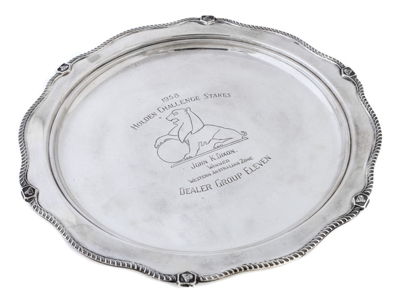 Sterling silver platter, engraved dedication "1958 Holden Challenge Stakes - John K. Dixon. Winner Western Australian Zone. Dealer Group Eleven." With GMH lion logo at centre, 31cm diameter, 775gms.