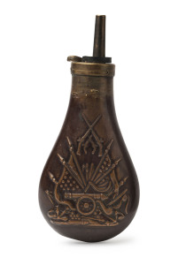 A copper powder horn with embossed artillery motif, 19th century, 18.5 cm high