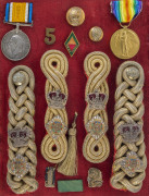 LT. COL. W.M. REEVE, 2nd Battalion, Victorian Rifles, A collection of military medals, uniform and hat badges, epaulettes, buttons and accoutrements, attractively displayed in four mounted presentations. Noted in particular VICTORIA VOLUNTEER Long & Effic - 3