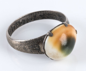 WW1 Trench art sweetheart ring made from a 1919 florin and cats eye shell (Operculum), most likely made in Eygpt or Palestine.