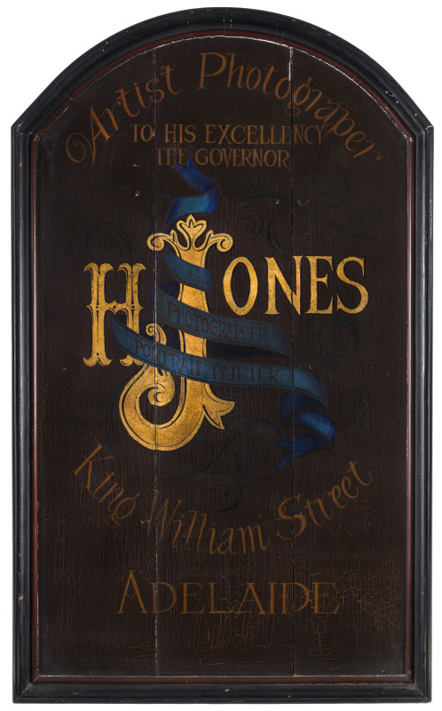 Advertising sign "H. JONES PHOTOGRAPHER AND PORTRAIT PAINTER, King William Street, Adelaide, Artist Photographer To His Excellency The Governor", painted wood, 19th century, ​117cm high, 73cm wide