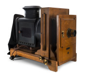 The Abbeydale horizontal Enlarger by W. Butcher & Sons., London, circa 1913, with Cooke Lens, Series V, 6&frac12; x 6&frac12; by Taylor, Taylor & Hobson. Made from mahogany, metal, brass and cardboard bellows. Length approx 53cm; height approx 46cm & width approx 23cm.