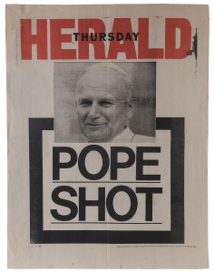 "POPE SHOT" & "POPE'S DAY OF TERROR" Thursday, May 14 & Friday, 15, 1981 Melbourne newspaper banner posters; each 66 x 51cm.The first attempted assassination of Pope John Paul II took place on Wednesday, 13 May 1981, in St. Peter's Square in Vatican City. The Pope was shot and wounded by Mehmet Ali Ağca while he was entering the square. The Pope was struck four times and suffered severe blood loss. Ağca was apprehended immediately and later sentenced to life in prison by an Italian court.