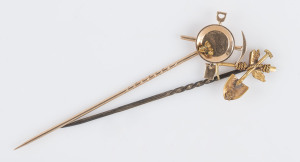 Two gold miner's stickpins with crossed pick and shovel plus gold pan and nuggets, 7cm and 8cm, 4.6 grams