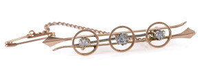 A Colonial bar brooch 15ct gold and Tasmanian osmiridium, 19th century, stamped "15ct" and housed in a plush box with Melbourne retailer's address, 5.5cm long, 3.6 grams