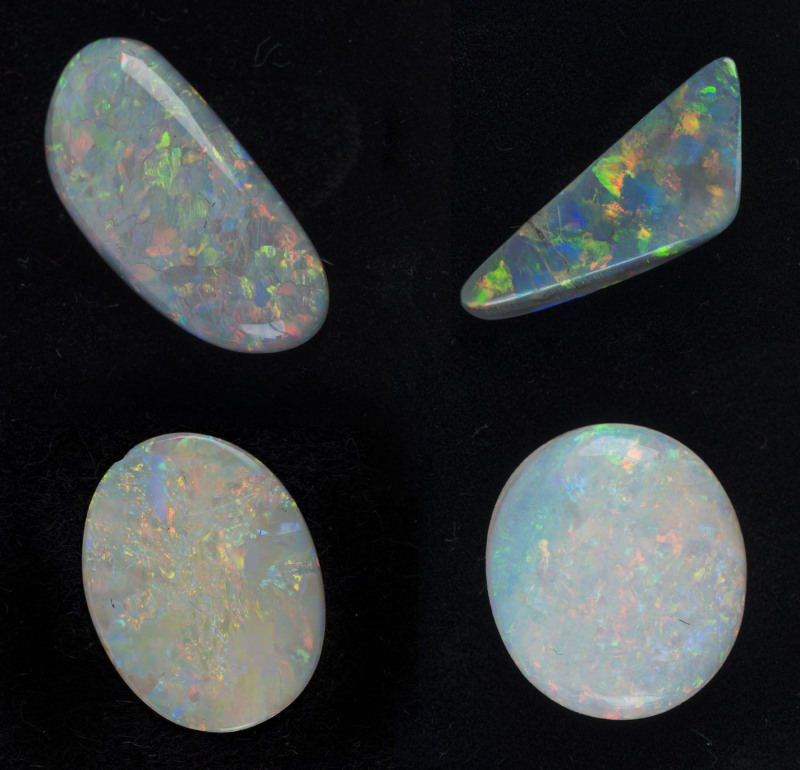 Four solid opals, both black and white, ranging from 4ct to 9ct each