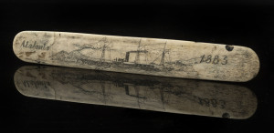 A scrimshaw whalebone busk with steamship titled "Atalanta, 1883",20cm long