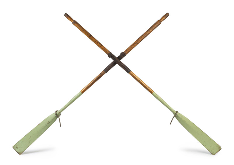 A pair of antique dinghy oars with green painted finish and leather mounting, late 19th century, ​245cm long