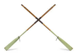 A pair of antique dinghy oars with green painted finish and leather mounting, late 19th century, ​245cm long