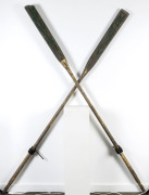 A pair of dinghy oars with green and yellow painted finish, 19th/20th century, 245cm long