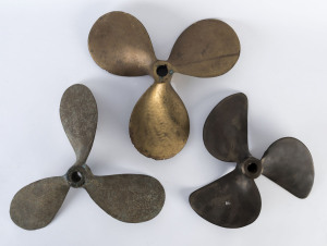 Three vintage boat propellers, solid cast brass, the largest 35cm across