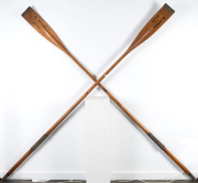 A pair of antique sculling oars marked "M. Denham, E.C.S.C.", ​280cm long