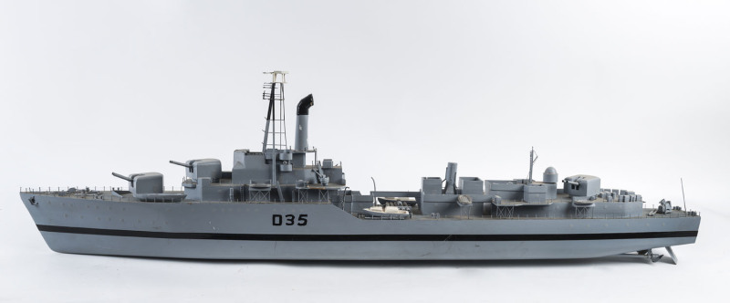 A scratch built model battleship, painted wood and metal, mid 20th century, ​127cm long