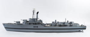 A scratch built model battleship, painted wood and metal, mid 20th century, 127cm long