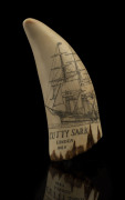 A scrimshaw whale's tooth engraved "Cutty Sark, London, 1869" with ship portrait and romantic scene on reverse, later wooden stand, ​tooth 21cm high