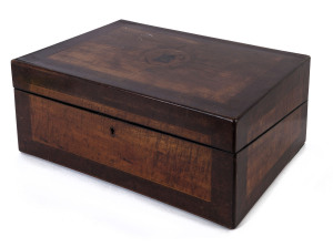 A Colonial writing box compendium, cedar and fiddleback blackwood with a central huon pine monogram surrounded by quartered panels, fitted interior with ebony trim on cedar with leathered writing slope, Tasmanian origin, mid 19th century, 16cm high, 36cm wide, 24cm deep