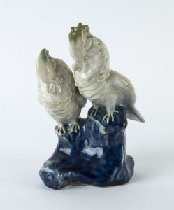 Royal Doulton figure group of a pair of cockatoos by Leslie Harradine, circa 1911, impressed factory mark, model No. H35 and inscribed "L.H.", 20cm high