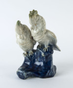 Royal Doulton figure group of a pair of cockatoos by Leslie Harradine, circa 1911, impressed factory mark, model No. H35 and inscribed "L.H.", ​20cm high