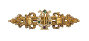 SUFFRAGETTE Yellow gold bar brooch in lyre form set with seed pearl, tourmaline and garnet, 19th century,