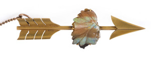 A Colonial bar brooch in the form of an arrow with finely carved solid opal formed as an Indian Chief, 19th century, stamped "18ct", 7cm long 9.8 grams total