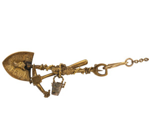 A gold miner's brooch with pick, shovel, rope and nuggets,marked "9ct, South Africa"