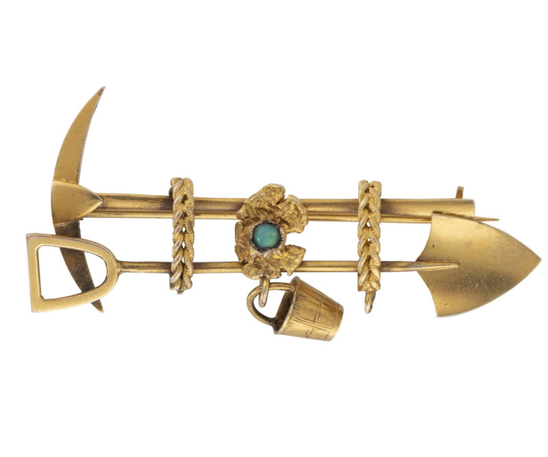 An Australian gold miner's brooch, yellow gold pick and shovel with rope and bucket adorned with nugget and turquoise, 19th century