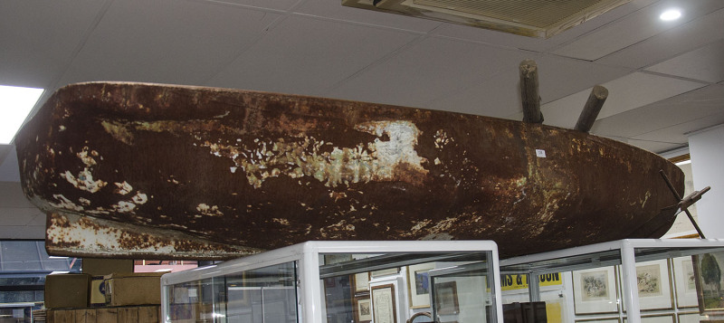 An Australian folk art dinghy made from the bonnets of two FJ Holdens with accompanying folk art anchor and oars, mid 20th century, found washed up on the banks of the Darling River in Western New South Wales, 225cm long