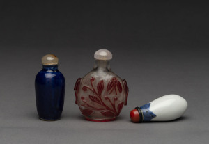 Three Chinese snuff bottles, peking glass and porcelain, 19th and early 20th century, the tallest 8cm high