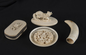 A Dieppe ivory wolf statue, ivory purse, ivory plaque and whale's tooth, 19th century, the wolf statue 8cm across