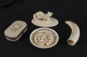 A Dieppe ivory wolf statue, ivory purse, ivory plaque and whale's tooth, 19th century, ​the wolf statue 8cm across