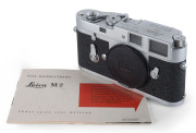 LEITZ: Leica M2 camera body [#1006937], 1960; Third type, with a self-timer and a lever for releasing the film rewind mechanism. Former owner's security code engraved on top plate. 