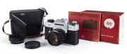 LEITZ: Leicaflex SL2 Jubilee edition camera 010-I [#1389478], 1975; with Summicron - R f2/50mm lens [#2436687], UV filter and lens hood. With Leitz black leather ERC and instruction manual.A total of 1,750 cameras were produced with the "50 Jahre" logo; s