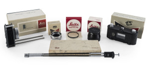 LEITZ: Accessories for Leica, comprising 16557Q (close focus bellows), 12575N (lens hood), OUAGO (focusing mount adaptor), OZTOM (double cable release), ELDIA/17105 (contact printer) & 13009 (UVa filter). All six items in original Leitz/Leica boxes.