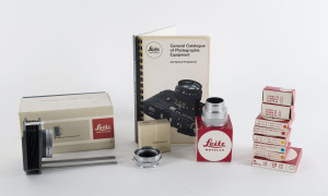 LEITZ: Accessories for Leica, comprising 16557Q (close focus bellows), OUAGO (focusing mount adaptor), 16471 (chrome extension tube), & 13009 (UVa filter), 13011D, 13013F, 13098M, 13101M & 13116B (colour filters), and 14022H (x2 take-up spools). All eleven items in original Leitz/Leica boxes.