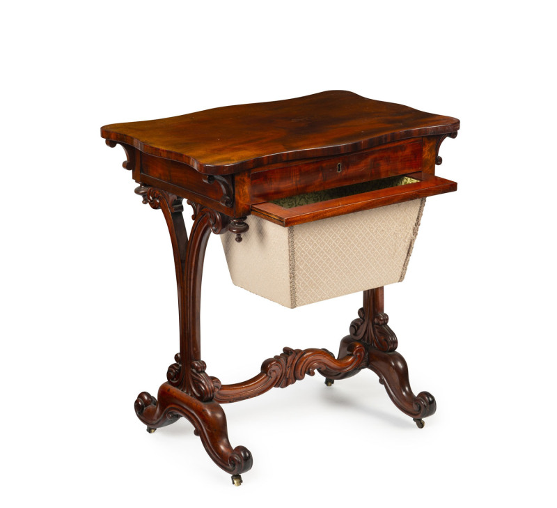 An English mahogany sewing table with serpentine top, circa 1865, 73cm high, 68cm wide, 45cm deep