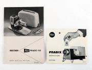 LEITZ: Slide projectors: Prado 150 [#290374] with instruction manual in fitted case circa 1955; also, Pradix projector in fitted case; with instructions; circa 1967.  - 2