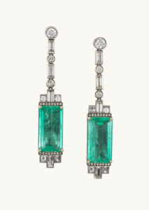 A spectacular pair of Art Deco pendant earrings, 18ct white gold with two impressive emeralds approximately 23.7ct and adorned with baguette and brilliant cut diamonds, stamped "CASTELLANI"