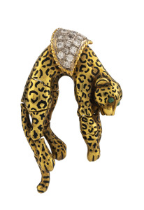 A leopard brooch 18ct gold and enamel set with approximately 2.5ct of brilliant cut diamonds and cabochon emerald eyes, stamped "18k,KI", 6cm high, 29.6 grams