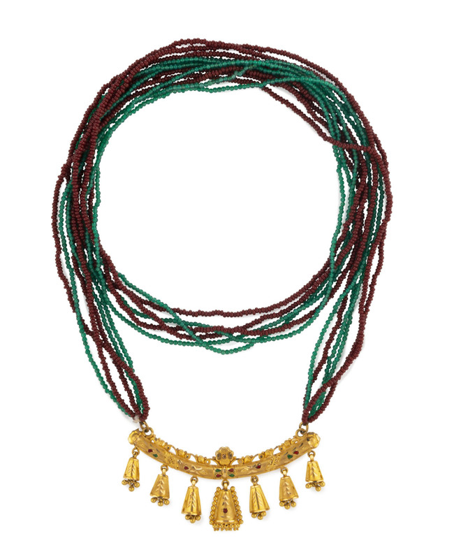 An Indian pendant neckalce, 23ct yellow gold frontispiece embalished with green and red enamel, suspended on six twisted strands of red jasper and chrysoprase beads, 31.2 grams total